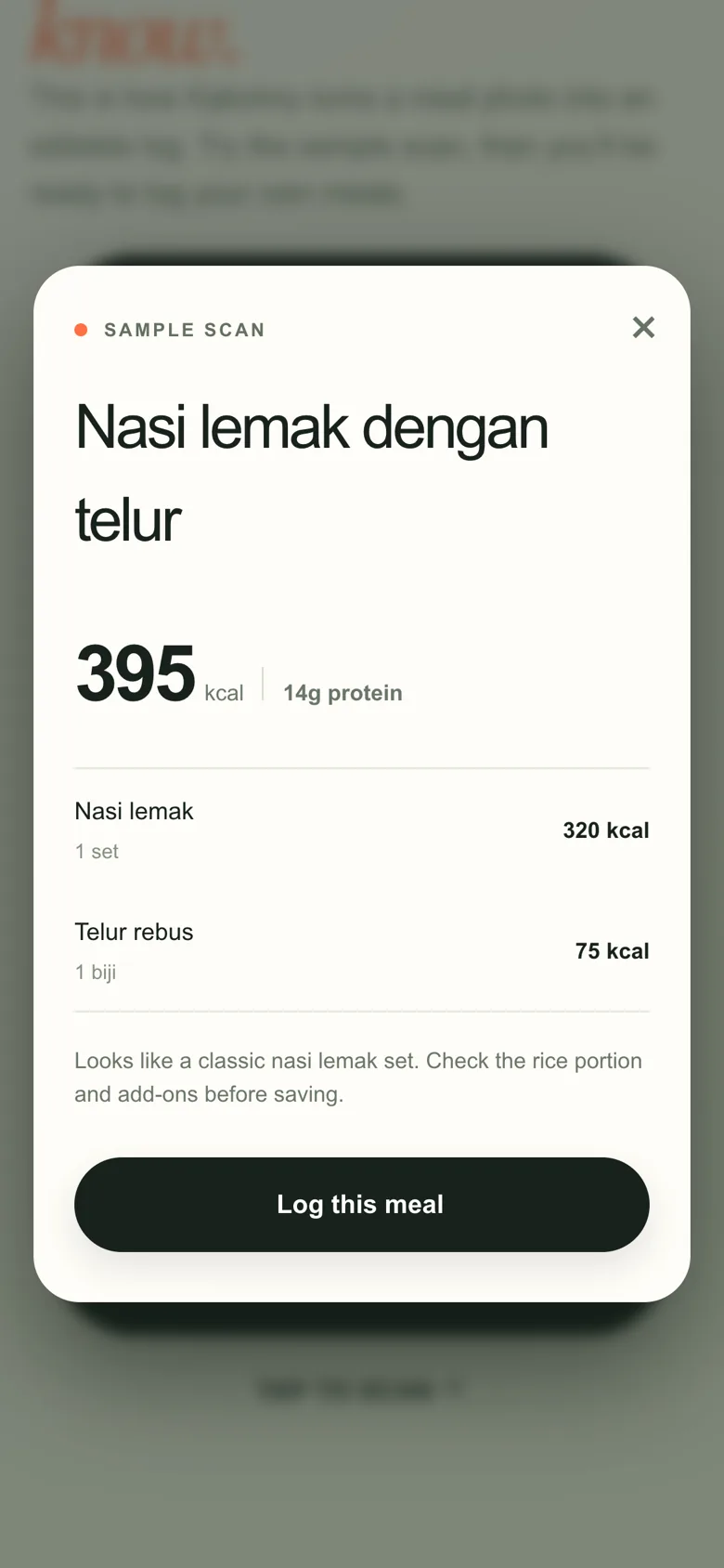 Kalorimy meal review sheet listing nasi lemak and telur rebus with a Log this meal button